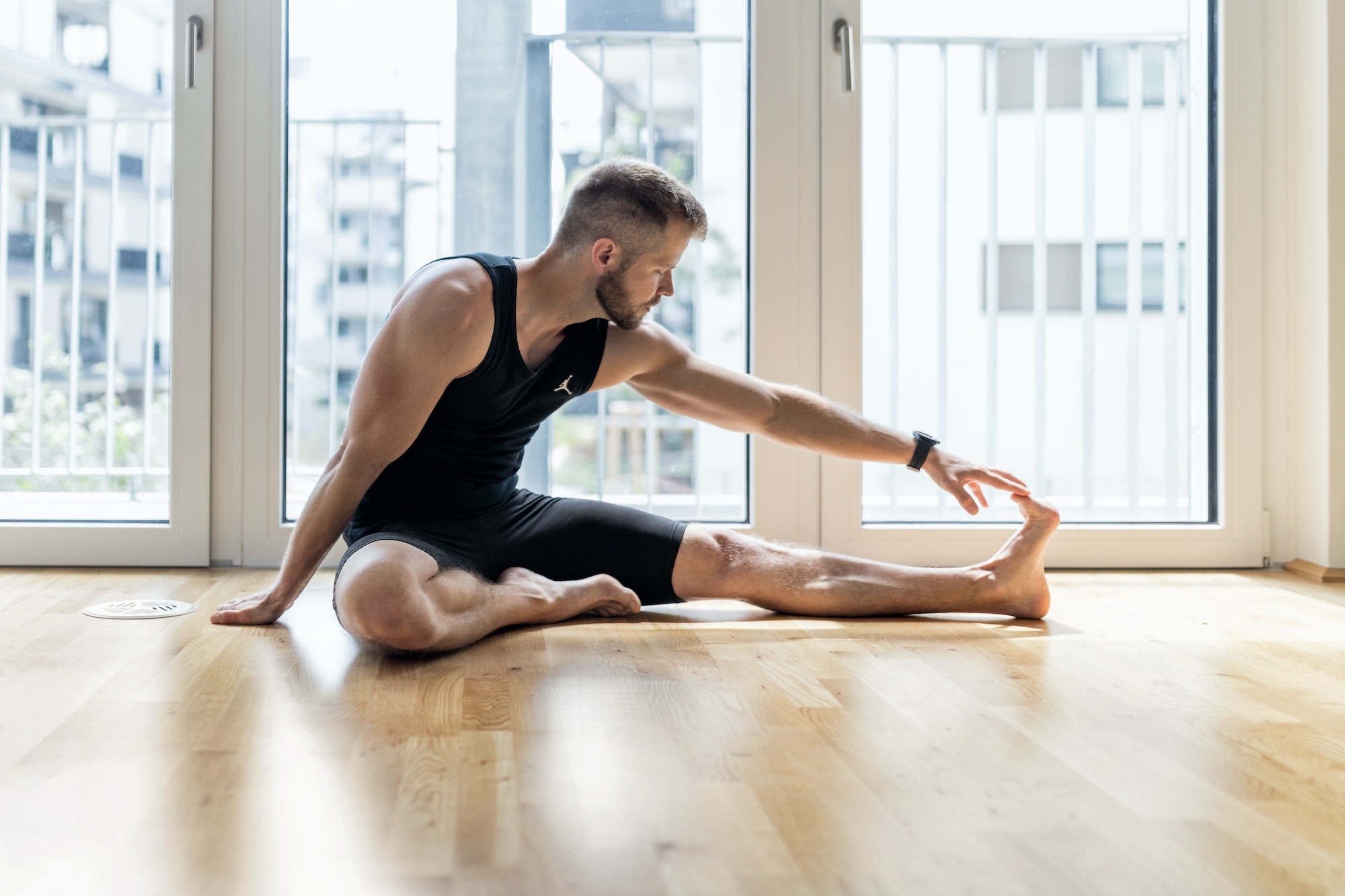 Man practicing yoga at his home